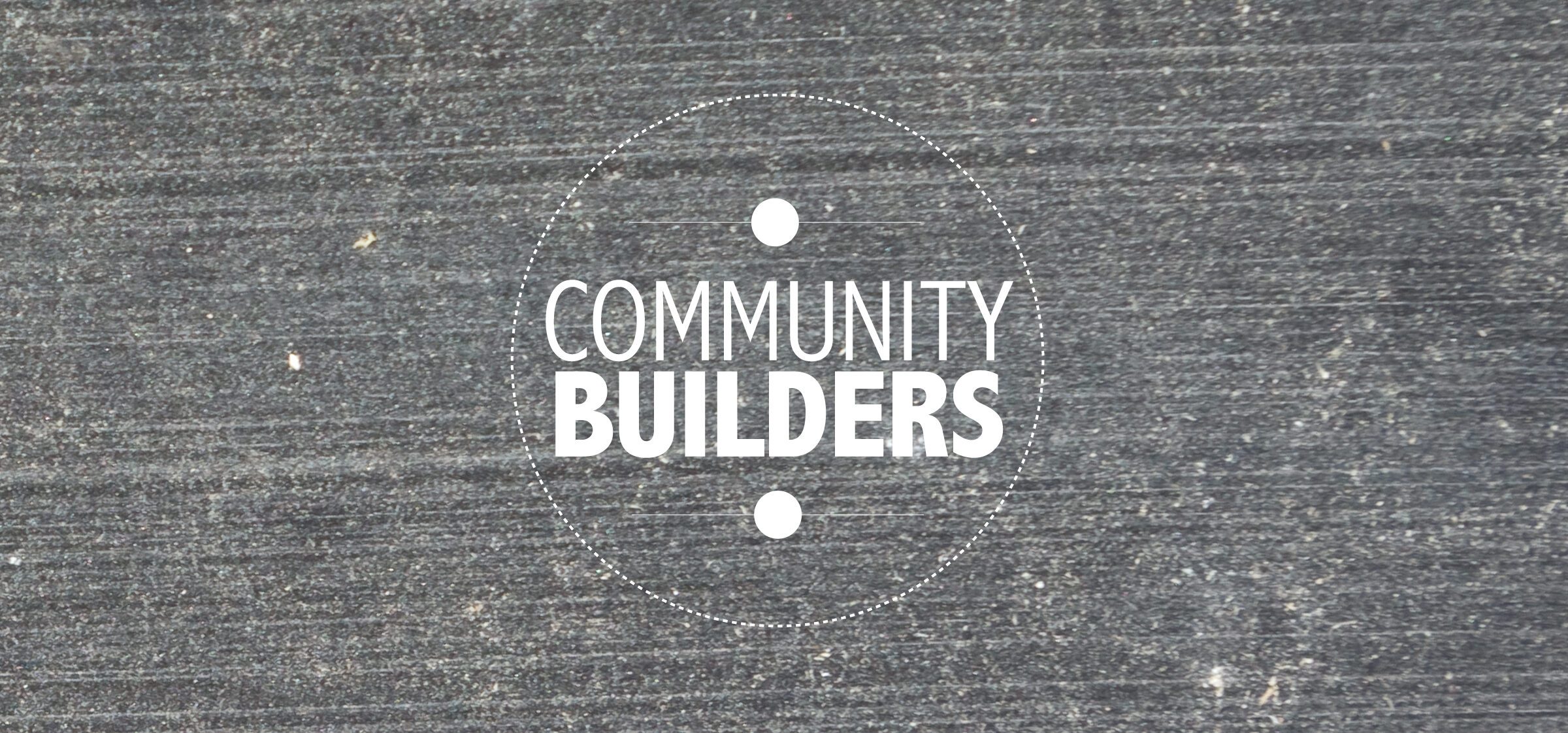 Community Builders logo set against a wood background 