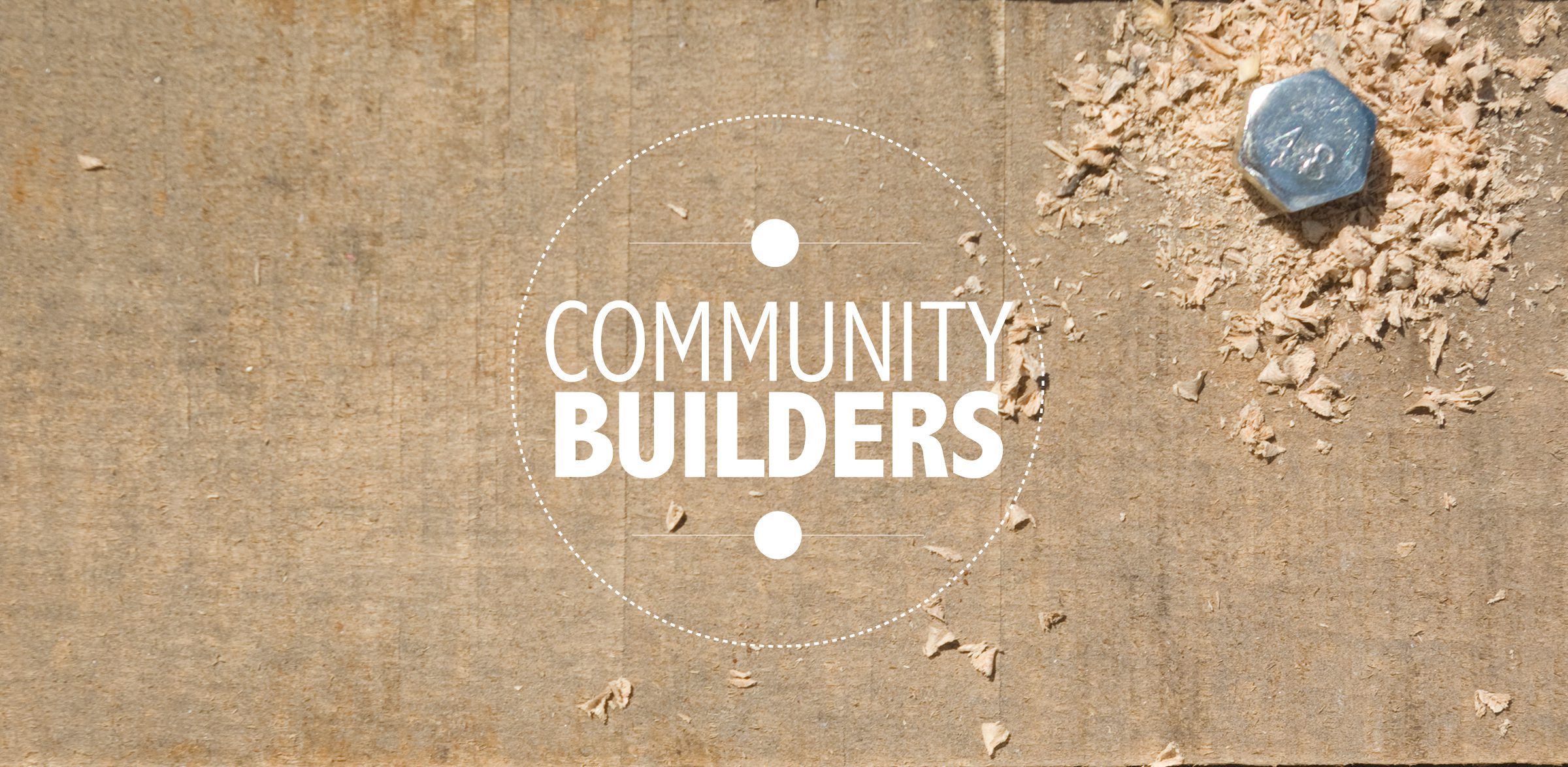 Community Builders logo on a wood background 