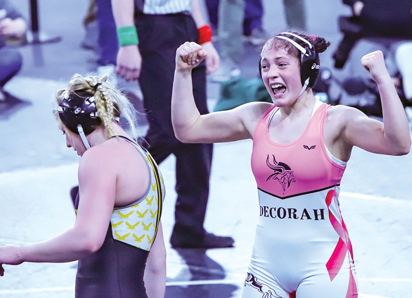 Naomi Simon celebrates a wrestling win